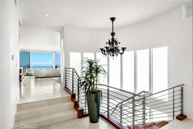 31091 Coast Hwy, Laguna Beach, CA 92651 - stairs featuring a chandelier and recessed lighting