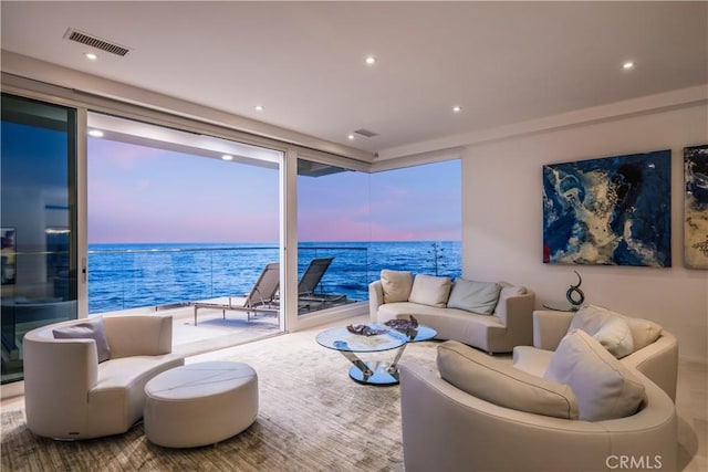 31091 Coast Hwy, Laguna Beach, CA 92651 - living room featuring recessed lighting, a wall of windows, visible vents, and a water view