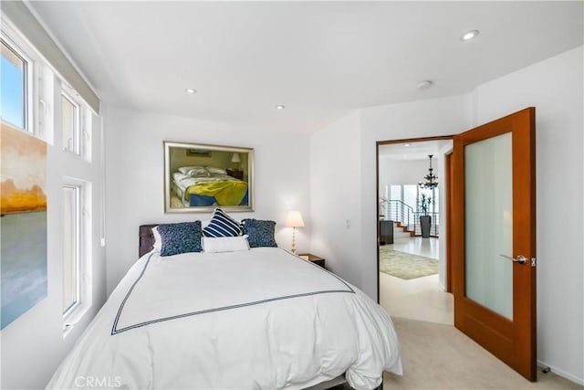 31091 Coast Hwy, Laguna Beach, CA 92651 - bedroom with recessed lighting, an inviting chandelier, and light carpet