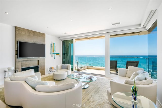 31091 Coast Hwy, Laguna Beach, CA 92651 - living room with visible vents, recessed lighting, floor to ceiling windows, and a fireplace