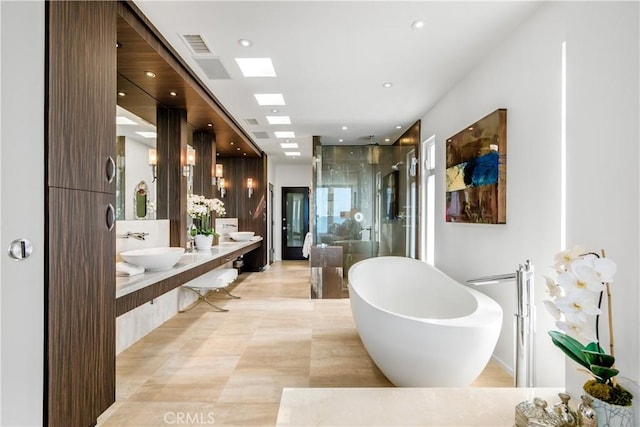 31091 Coast Hwy, Laguna Beach, CA 92651 - bathroom featuring a freestanding tub, recessed lighting, a sink, a stall shower, and double vanity