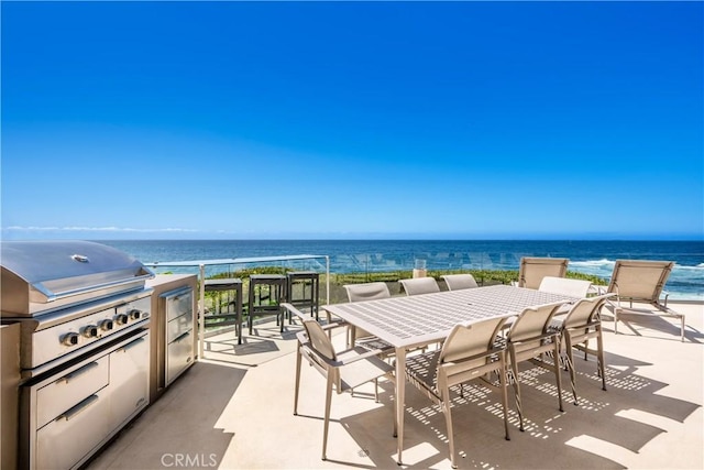 31091 Coast Hwy, Laguna Beach, CA 92651 - view of patio / terrace featuring a water view, outdoor dining area, grilling area, and an outdoor kitchen