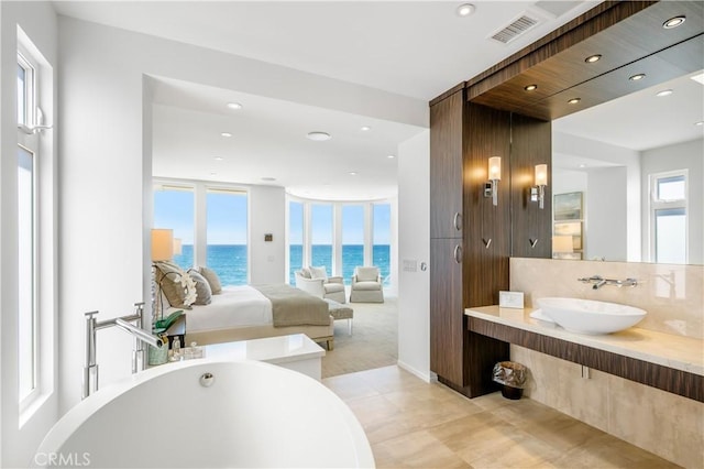 31091 Coast Hwy, Laguna Beach, CA 92651 - full bathroom with a soaking tub, recessed lighting, ensuite bath, visible vents, and a water view