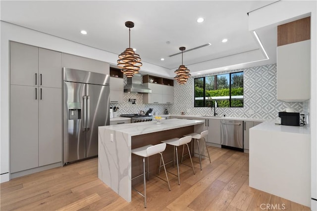 4739 Ventura Canyon Ave, Sherman Oaks, CA 91423 - kitchen featuring a sink, appliances with stainless steel finishes, wall chimney range hood, and tasteful backsplash