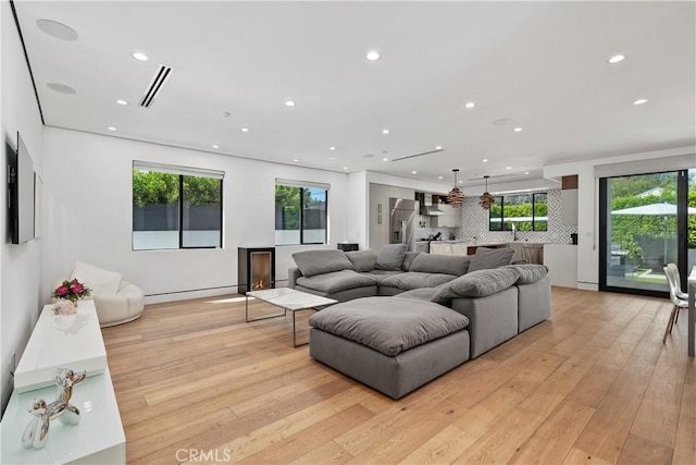 4739 Ventura Canyon Ave, Sherman Oaks, CA 91423 - living room featuring recessed lighting, plenty of natural light, and light wood-style floors