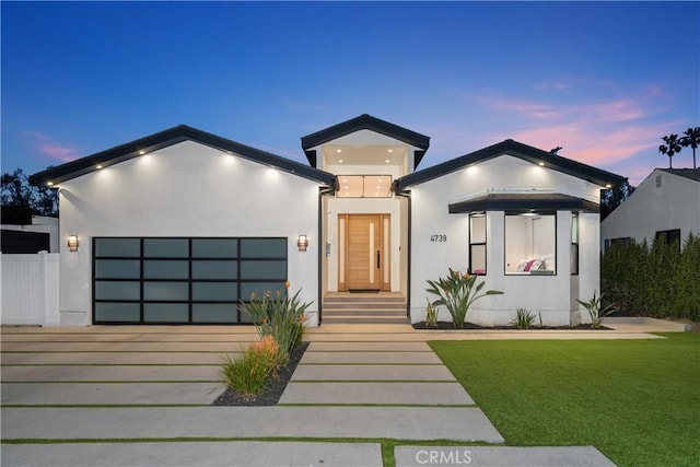 4739 Ventura Canyon Ave, Sherman Oaks, CA 91423 - view of front of house with a front lawn, driveway, a garage, and stucco siding