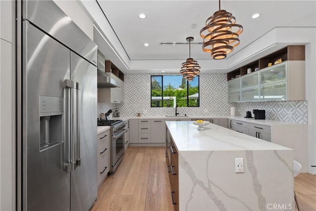 4739 Ventura Canyon Ave, Sherman Oaks, CA 91423 - kitchen with open shelves, a center island, a sink, light wood-type flooring, and premium appliances