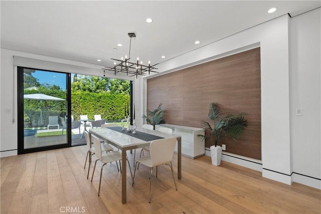 4739 Ventura Canyon Ave, Sherman Oaks, CA 91423 - dining area featuring an accent wall, light wood-style floors, recessed lighting, and a notable chandelier