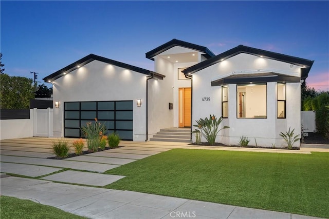 4739 Ventura Canyon Ave, Sherman Oaks, CA 91423 - modern home with stucco siding, a front lawn, driveway, and an attached garage