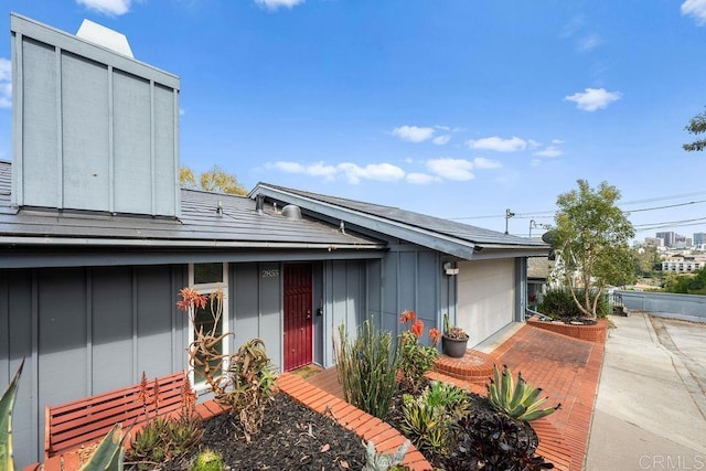 view of front of house with an attached garage and board and batten siding