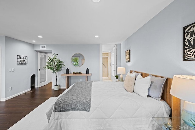 bedroom with visible vents, baseboards, wood finished floors, and recessed lighting