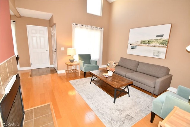 16700 Yukon Ave Unit 204, Torrance, CA 90504 - living area with a fireplace, baseboards, and wood finished floors