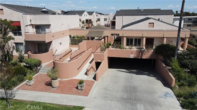16700 Yukon Ave Unit 204, Torrance, CA 90504 - exterior space featuring a residential view, a garage, and concrete driveway