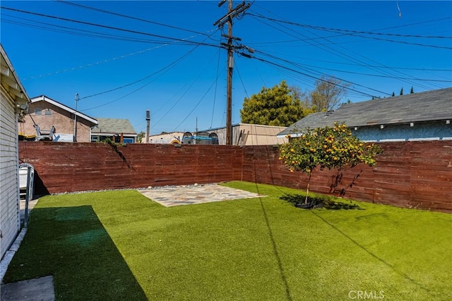 5717 4th Ave, Los Angeles, CA 90043 - view of yard featuring a patio area and a fenced backyard