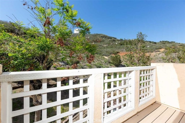 wooden terrace featuring a mountain view