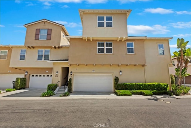 374 Quail Rdg, Irvine, CA 92603 - multi unit property featuring an attached garage and stucco siding