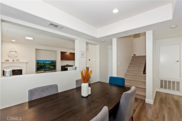 374 Quail Rdg, Irvine, CA 92603 - dining space featuring stairs, wood finished floors, recessed lighting, and a fireplace