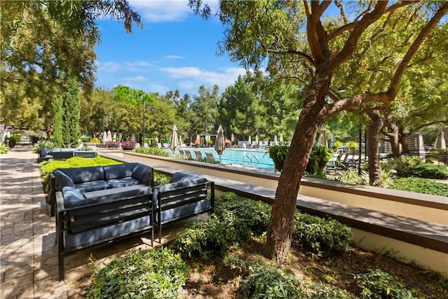 374 Quail Rdg, Irvine, CA 92603 - surrounding community with a swimming pool and view of wooded area