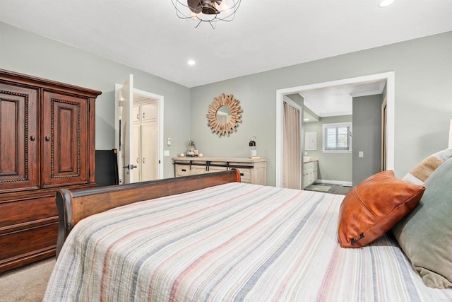 bedroom with ensuite bathroom, baseboards, and recessed lighting