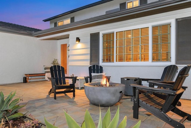 view of patio with a fire pit