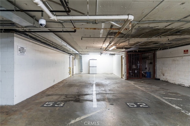 parking deck featuring concrete block wall