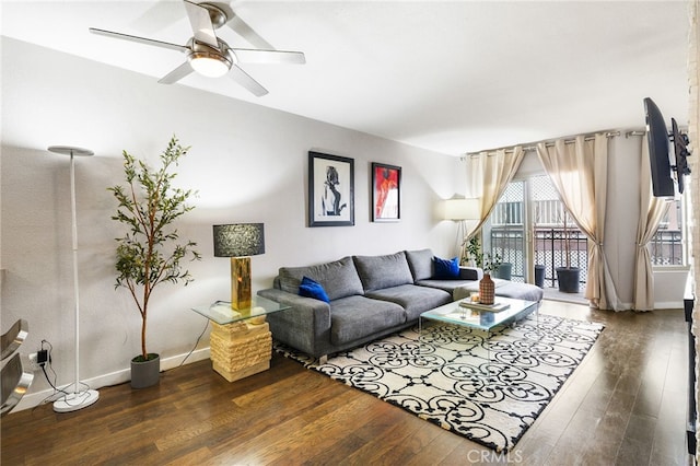 living room with ceiling fan, wood finished floors, and baseboards
