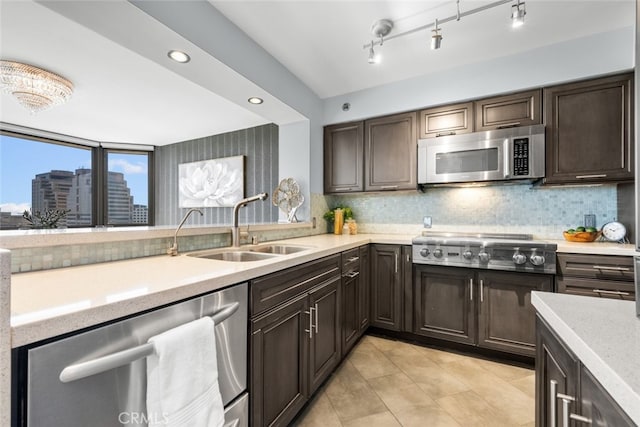 222 Monterey Rd Unit 1203, Glendale, CA 91206 - kitchen with tasteful backsplash, dark brown cabinets, light countertops, a sink, and stainless steel appliances