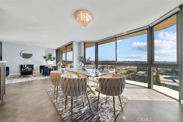 222 Monterey Rd Unit 1203, Glendale, CA 91206 - dining area featuring an inviting chandelier, baseboards, and a wall of windows