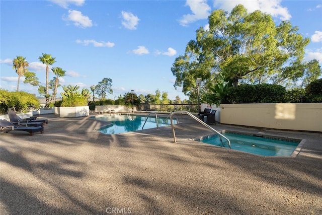 222 Monterey Rd Unit 1203, Glendale, CA 91206 - view of swimming pool with a fenced in pool, a patio, an in ground hot tub, and fence
