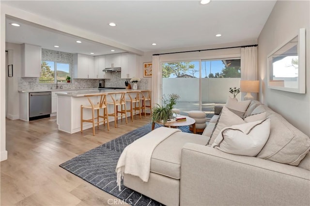 32152 Via Carlos, San Juan Capistrano, CA 92675 - living room with light wood finished floors and recessed lighting