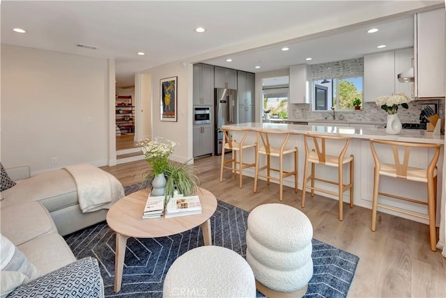 32152 Via Carlos, San Juan Capistrano, CA 92675 - living room featuring light wood finished floors and recessed lighting