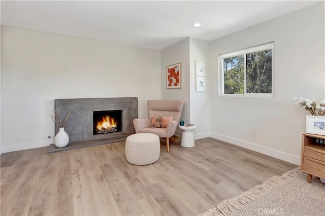 32152 Via Carlos, San Juan Capistrano, CA 92675 - sitting room featuring wood finished floors, a high end fireplace, and recessed lighting