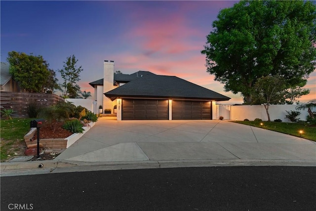 32152 Via Carlos, San Juan Capistrano, CA 92675 - view of front facade with driveway, a chimney, and an attached garage