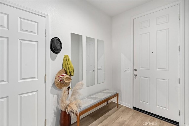 mudroom with light wood finished floors