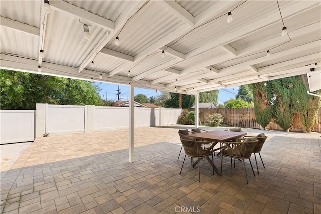 view of patio featuring a fenced backyard and outdoor dining area