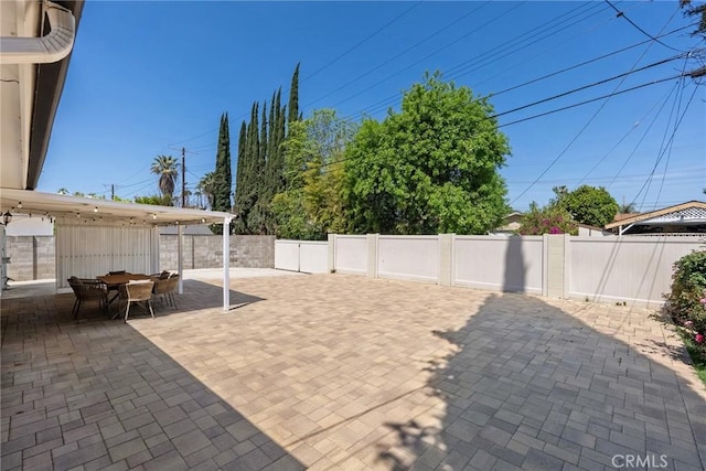 view of patio / terrace featuring fence and outdoor dining space