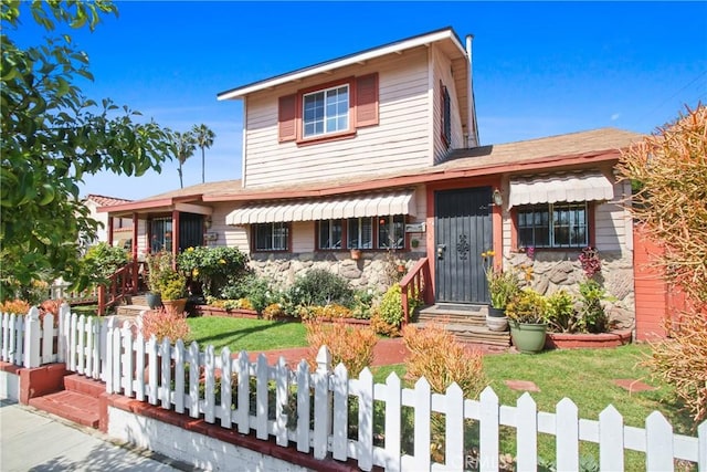 view of front of property with a fenced front yard