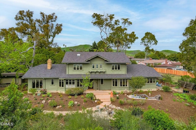402 Lynn Dr, Ventura, CA 93003 - back of property with roof with shingles, fence, and a chimney