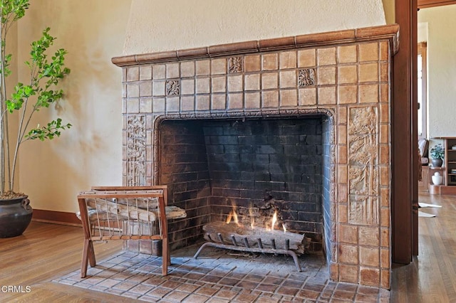 402 Lynn Dr, Ventura, CA 93003 - details with a fireplace with flush hearth, baseboards, and wood finished floors