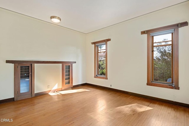 402 Lynn Dr, Ventura, CA 93003 - unfurnished living room with baseboards and hardwood / wood-style flooring
