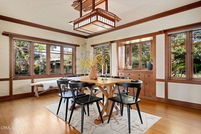 402 Lynn Dr, Ventura, CA 93003 - dining room with light wood finished floors, baseboards, and crown molding