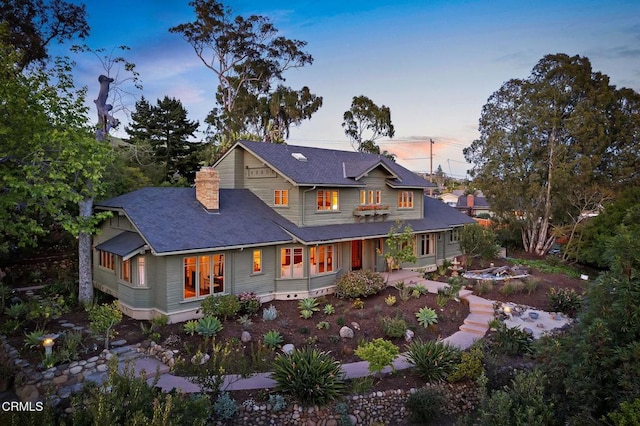 402 Lynn Dr, Ventura, CA 93003 - back of house at dusk with roof with shingles and a chimney