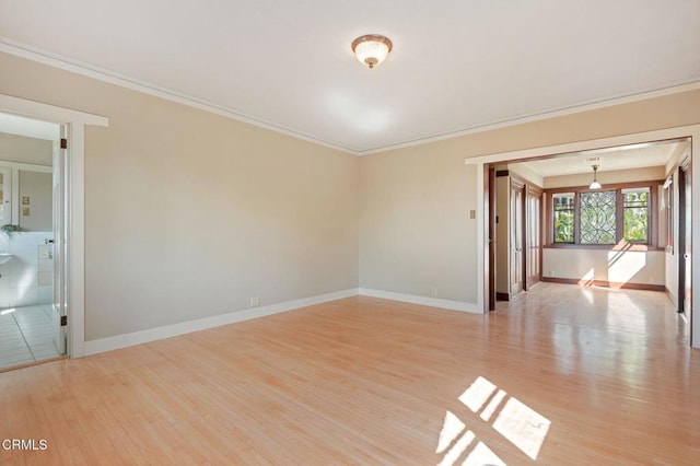 402 Lynn Dr, Ventura, CA 93003 - spare room featuring crown molding, baseboards, and light wood finished floors