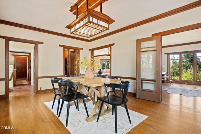 402 Lynn Dr, Ventura, CA 93003 - dining space featuring light wood-style flooring, baseboards, and ornamental molding