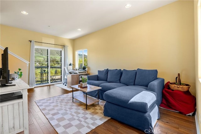 living room with recessed lighting and wood finished floors