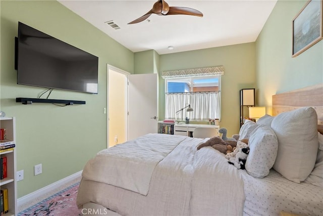 bedroom with visible vents, baseboards, a ceiling fan, and carpet floors