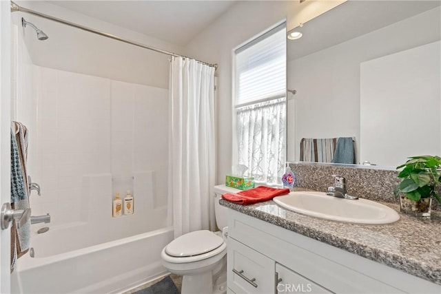 bathroom featuring shower / tub combo, vanity, and toilet