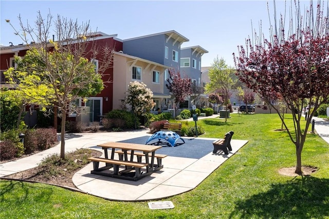 view of property's community with a yard