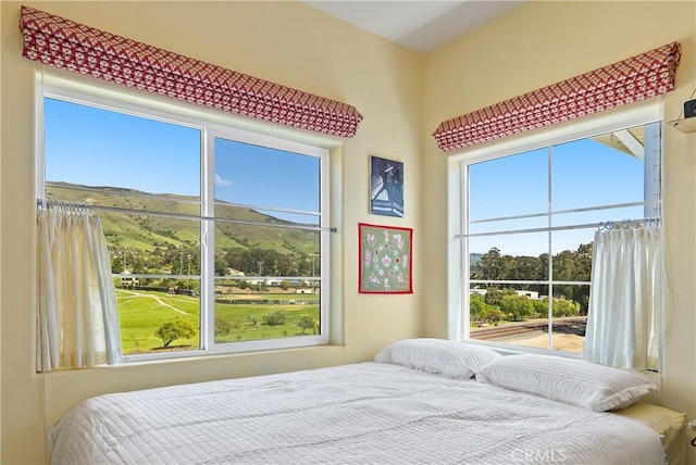 bedroom with a mountain view