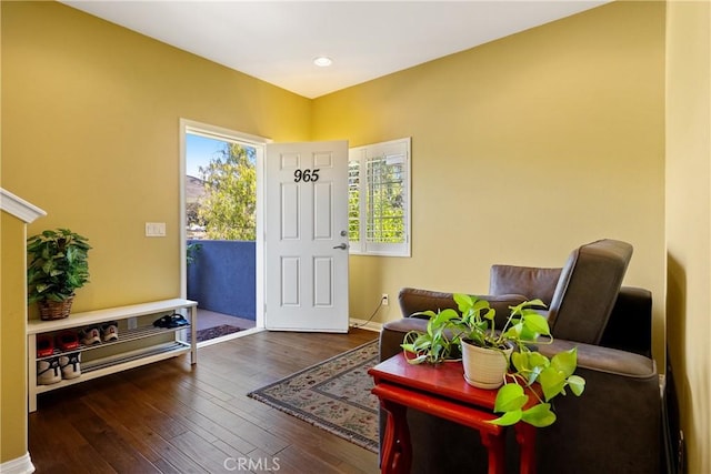 interior space featuring recessed lighting, wood-type flooring, and baseboards